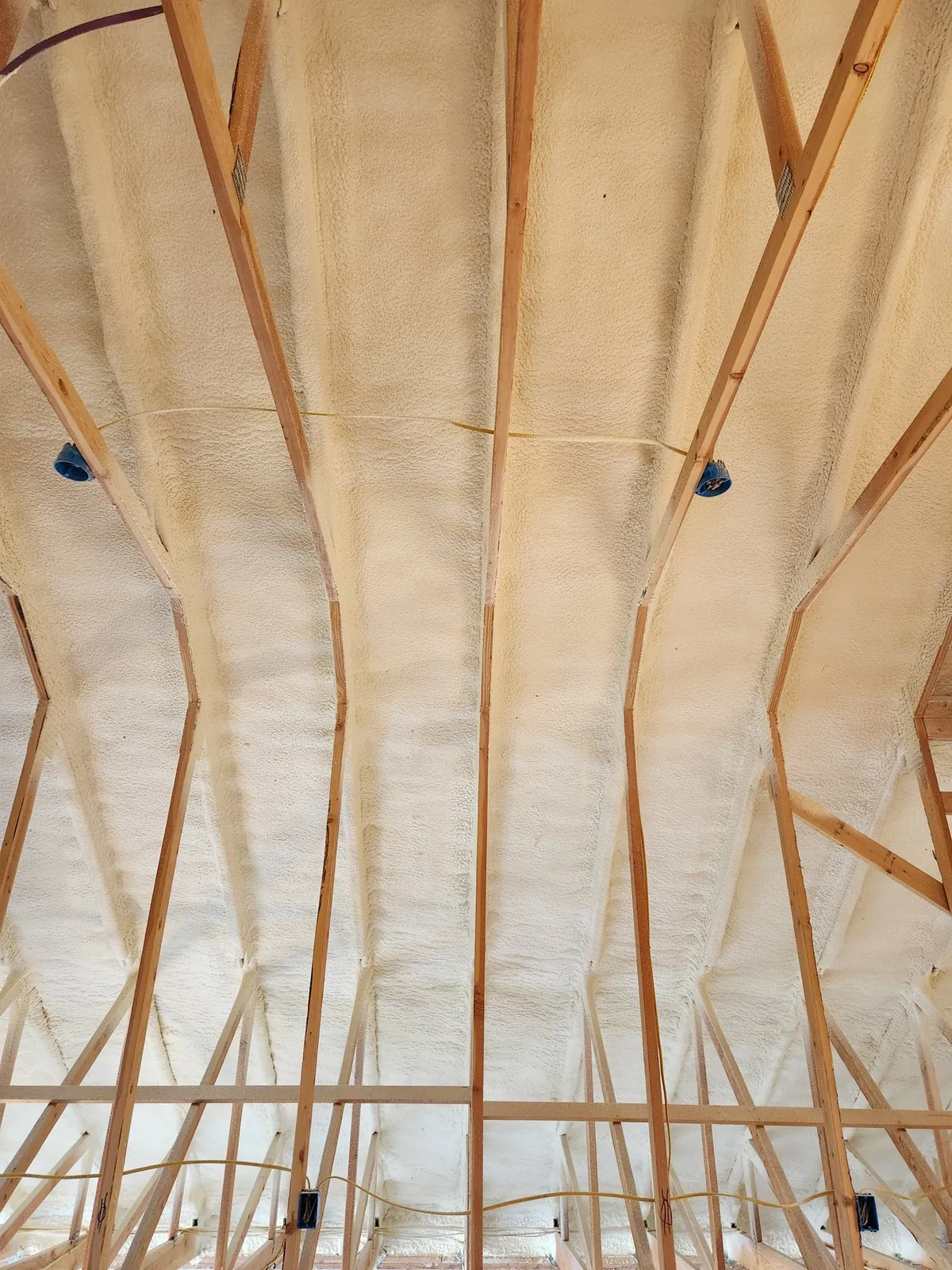 Spray foam applied to a ceiling assembly, an example of the work Peak Insulation provides for homes and shops in the Kalispell, Montana service area