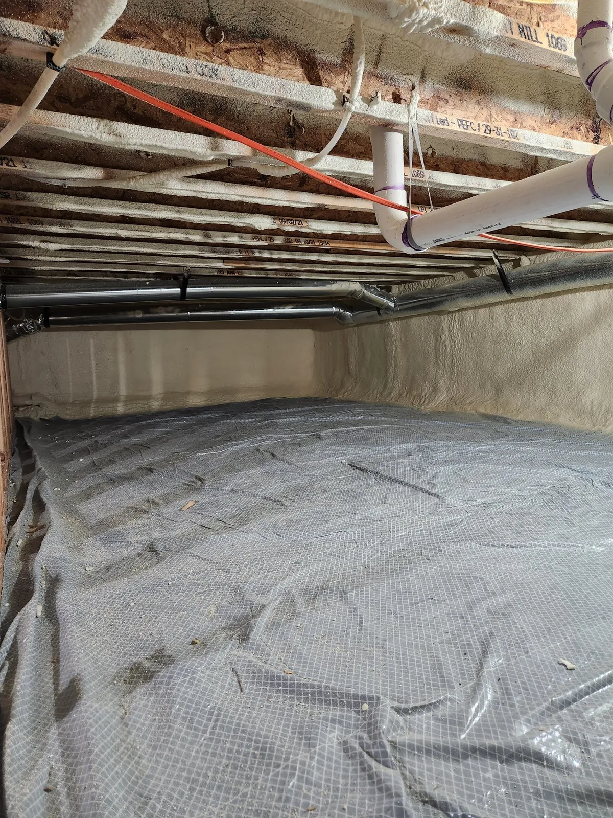 Closed-cell foam applied to a foundation corner, an example of the work Peak Insulation provides for homes and shops in the Kalispell, Montana service area