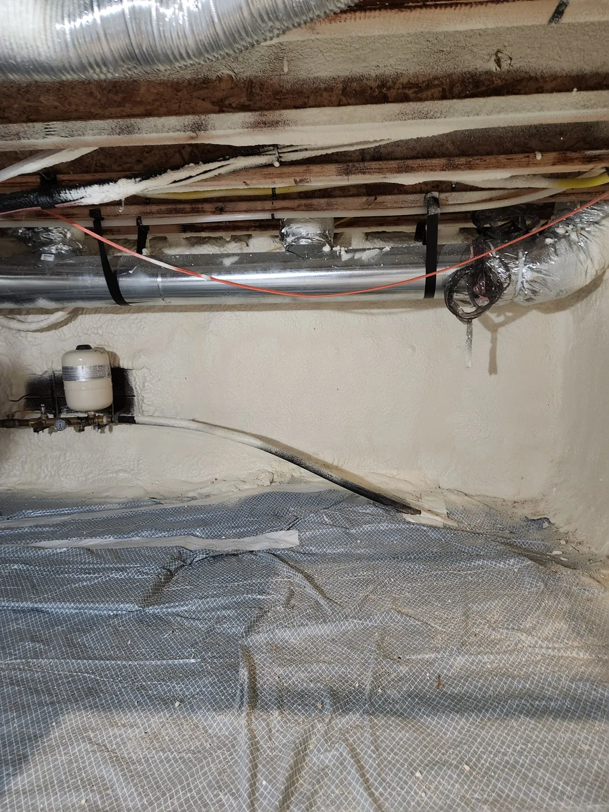 Sealed crawl space with vapor barrier and equipment, an example of the work Peak Insulation provides for homes and shops in the Kalispell, Montana service area