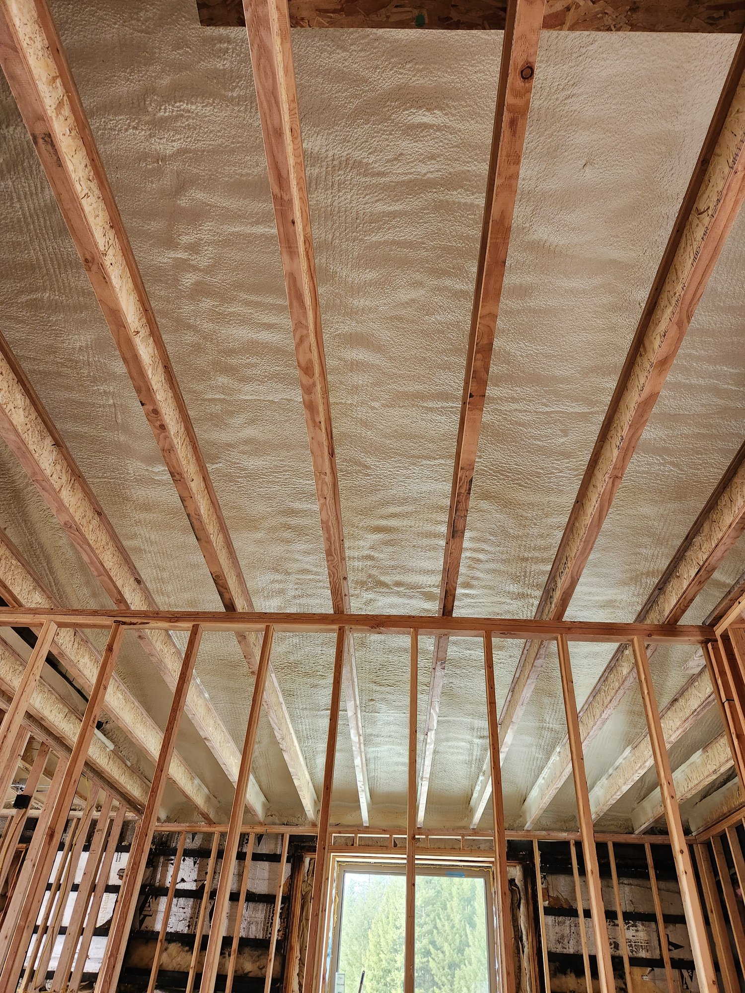 Attic Spray Foam Insulation installation in progress